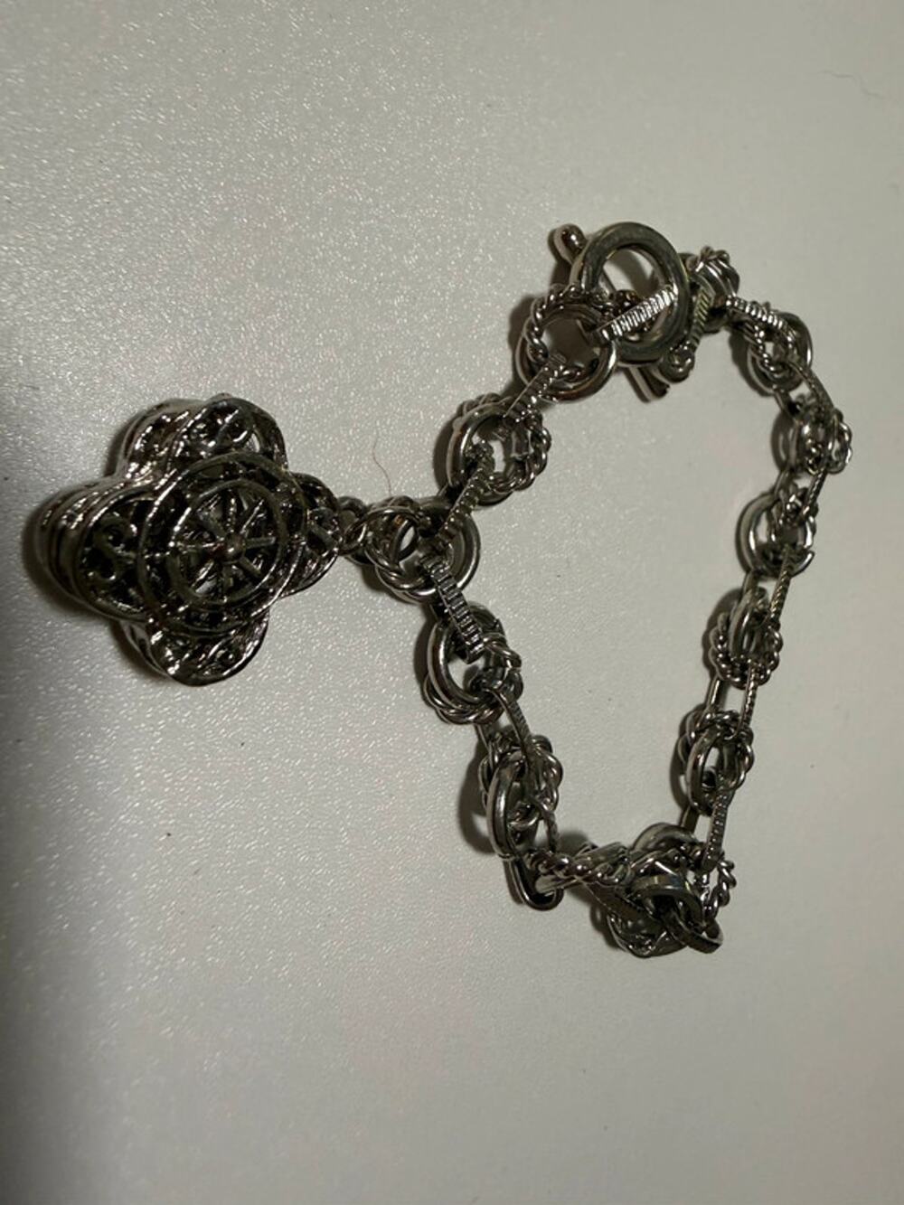Silver tone charm bracelet 8” with one charm